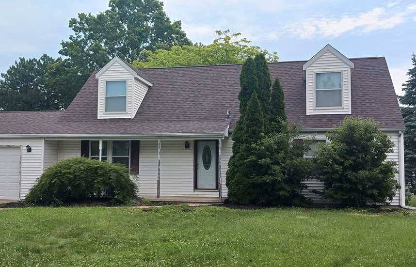 Roofing contractor installed a home on this multi story home on the shores of Lake Erie in Oak Harbor.