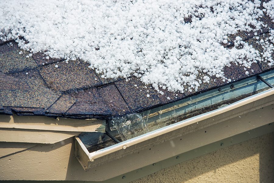 Hail piled up on a roof after a hail storm. 