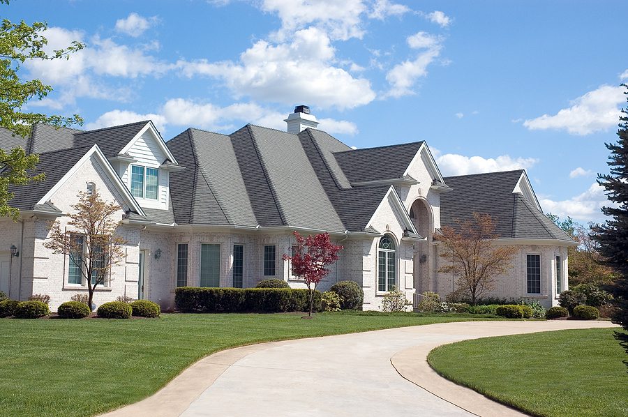 Large  modern home with a new roof with asphalt shingles. 